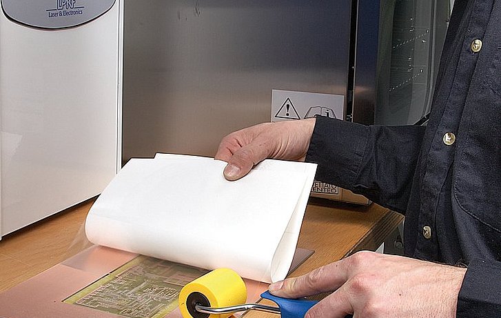 Applying the protective foil and drilling the through holes Applying the protective foil and drilling the through holes